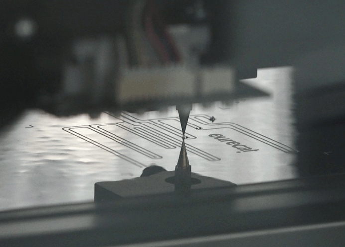 Placing electronic SMDs (surface-mount devices) components onto a functional film using pick and place equipment.